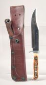 A PUMA ORIGINAL BOWIE KNIFE 116396, with stainless steel blade and antler handle, 10.5