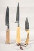 THREE KNIVES, with bone and antler handles.