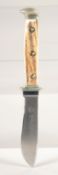 A PUMA KNIFE, with antler handle, 7.5