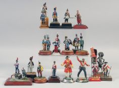 A COLLECTION OF TWENTY FIVE VARIOUS METAL SOLDIERS, on a stand, (25).
