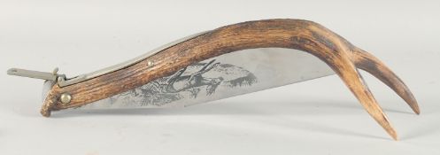 INDIANA INOX, A LARGE HUNTING KNIFE, the blade engraved with two deer and a dog, blade 12