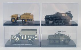 FOUR VARIOUS ARMORED VEHICLES, boxed.