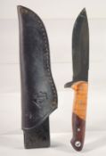 A JAGANICKER OLIVE / COCO KNIFE, in a leather sheath, 8.5