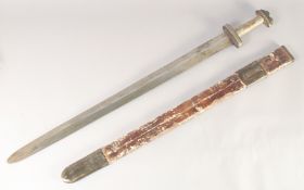 A REPLICA OF A VIKING SWORD, early 20th century, wide straight pointed 33in blade, hilt with leather