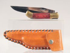A LAGUIOLE FOLDING KNIFE, with brass and wooden handle, 7