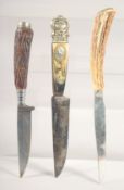 THREE VARIOUS KNIVES, with antler handles, 8