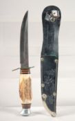 A SCHNEIDTEUFE SOLINGEN GERMANY KNIFE, with antler handle, in a leather sheath with deer, 9
