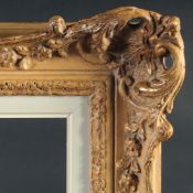 A 20th Century swept frame with pierced centres and corners with a painted slip, rebate size 20