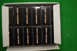 Twelve jeweller's loupes.