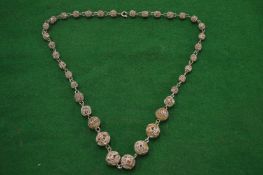 A filigree necklace.