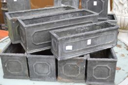 Seven faux lead rectangular planters.