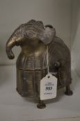A cast metal elephant form box and cover.