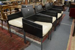 KFF design, a set of four leather armchairs.