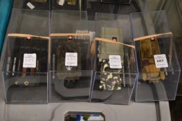 Four various armoured vehicles, boxed.