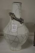A Chinese crackle glaze vase with a dragon to the neck.