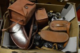 Various binoculars and cameras.