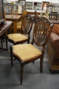 A set of six shield back dining chairs, two with arms.