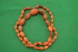 An amber bead necklace.