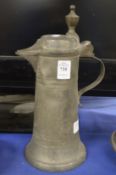 A pewter lidded jug.