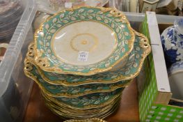 A green and gilt decorated dessert service.