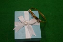 A decorative bangle.