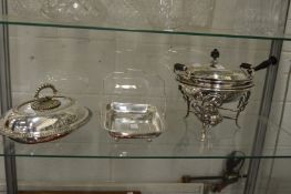 A plated chafing dish on stand with burner, an entree dish and cover and a swing handle basket.