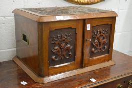 A good Victorian carved walnut two door cutlery canteen or collectors cabinet, the pair of doors