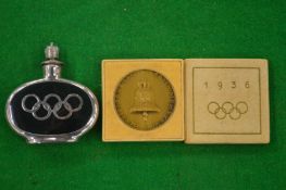 A 1936 Olympic commemorative medallion together with an Olympic miniature perfume flask.