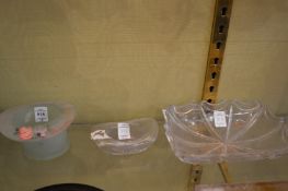 Three small glass dishes.