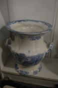 A large blue and white twin handled urn.