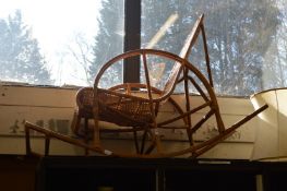 A bamboo and wicker rocking chair.