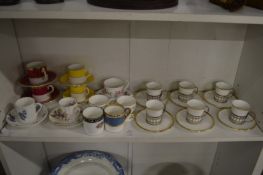 A set of six Shelly coffee cups and saucers with silver holders together with other coffee cups
