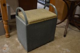 A Lloyd loom linen basket.