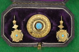 A Victorian circular yellow metal brooch mounted with turquoise stones together with a pair of