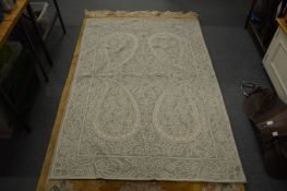 An Oka embroidered throw.