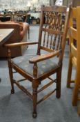 A pair of oak spindle back carver chairs and four similar single chairs.