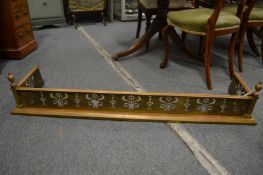 A 19th century brass fender with pierced fretwork front and urn finials, 4' 2