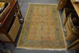 A cream ground rug with a floral decoration 6' x 3' 10