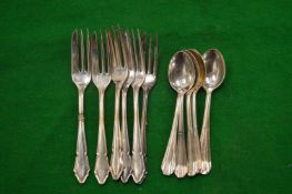 Plated spoons and forks.