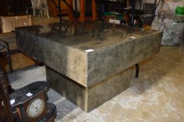 A modern square shaped coffee table.