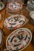 A pair of Masons ironstone tureens and covers and matching plates.