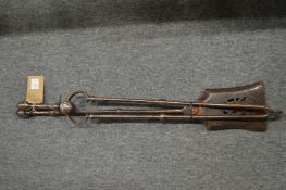 A pair of steel fire irons.