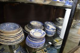 A quantity of blue and white plates, saucers, bowls.