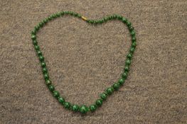 A malachite bead necklace.
