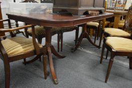 A mahogany twin pillar extending dining table.