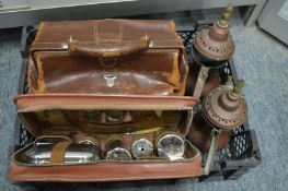 Two Eastern copper ewers, a gents travelling vanity case, and a small leather doctor's bag.