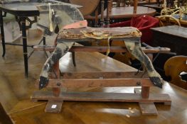 An early small painted rocking horse on pine stand.