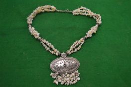 A highly ornate necklace.