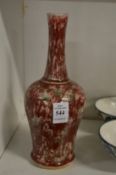 A Chinese red and green speckle vase.