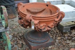 A good set of three large terracotta classical shaped pedestal garden urns/planters.